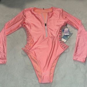 Brand new neon peachy pinky bathing suit long sleeve with cutouts on the side